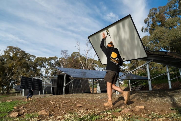 my energy staff carrying solar panel for ground mounted solar panel array