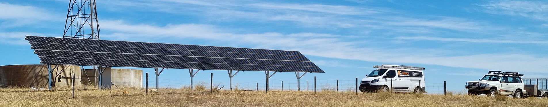 Ground-mounted solar array at a rural site with a MyEnergy service vehicle
