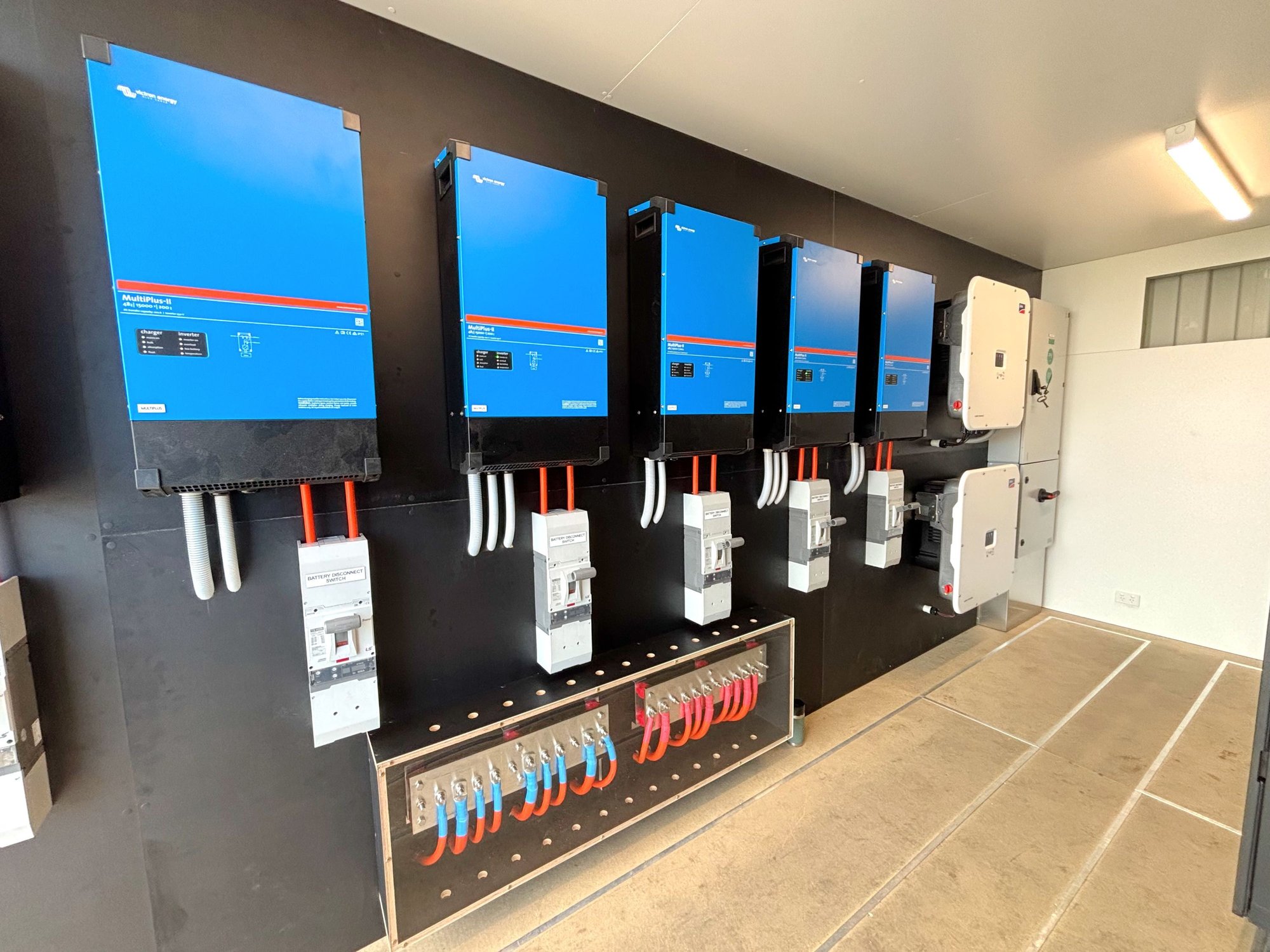 a containerised off grid power system featuring 6 victron inverters and sma inverters