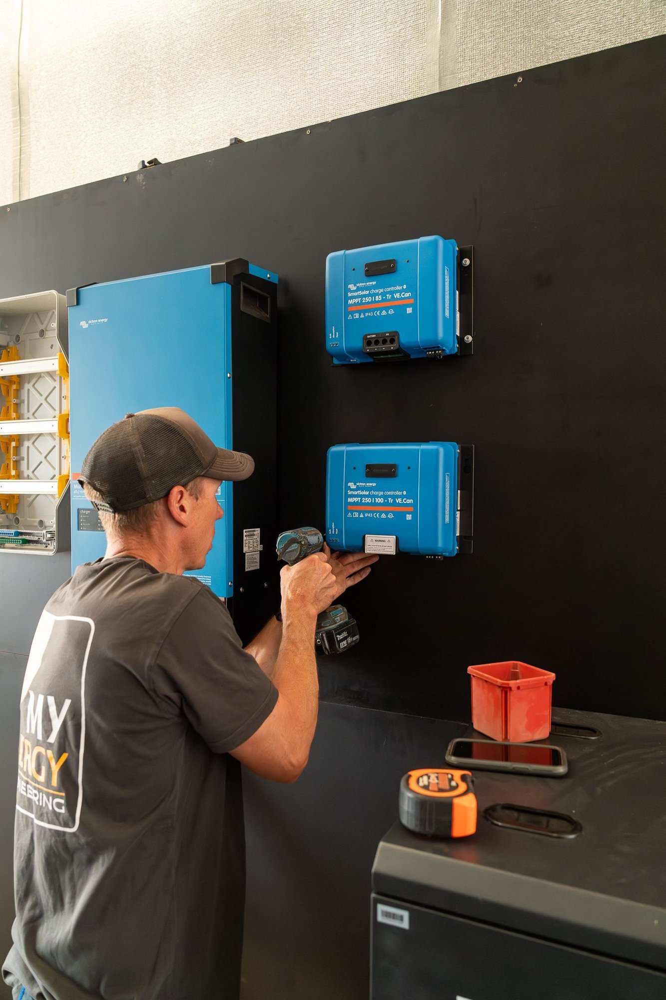 brad, lead electrician at MyEnergy building an off grid power wall at a residential home in hahndorf, south australia.