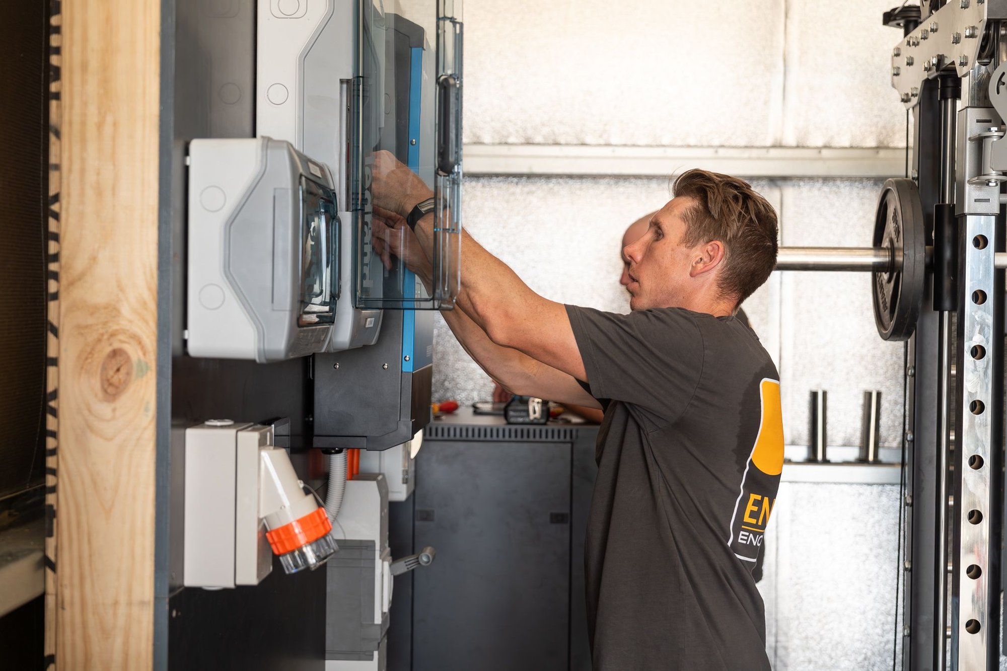 lead electrician Brad building a power wall for a residential off grid property in hahndorf, south australia