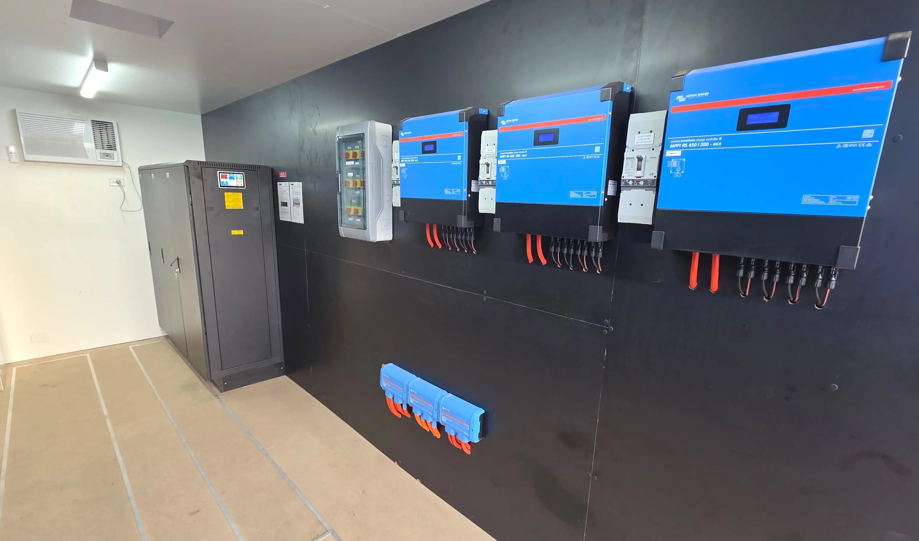 inside the shipping container victron smartsolar charge controllers, battery cabinet and victron cerbo